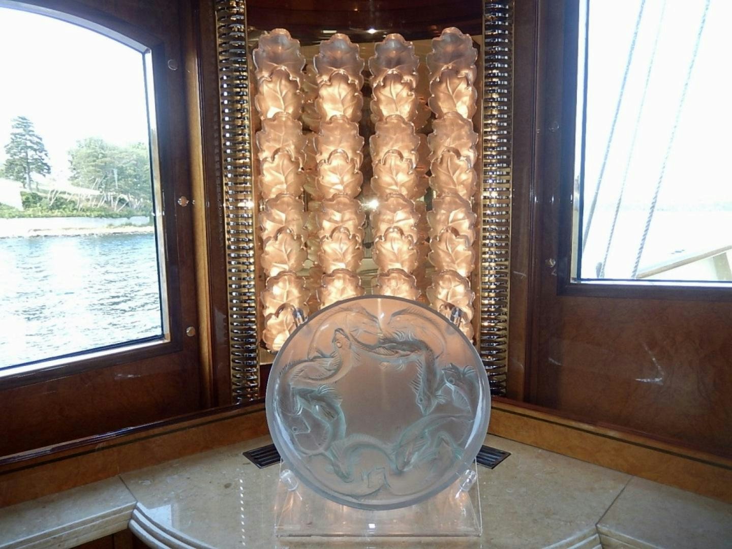 a gold plate with a gold plate and a gold plate on it aboard ATLANTIDE Yacht for Sale