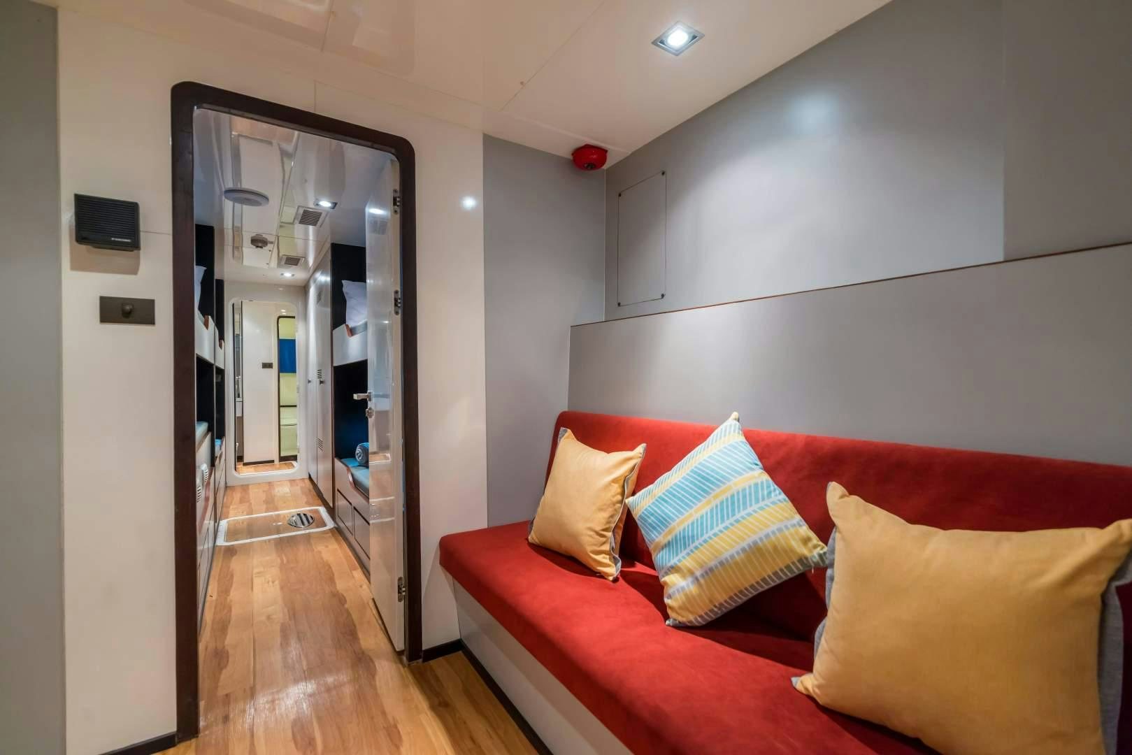 a couch in a room aboard PHATSARA Yacht for Sale