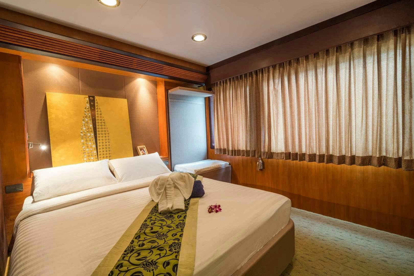 a room with two beds aboard PHATSARA Yacht for Sale