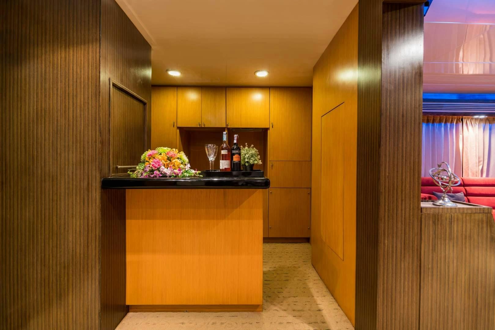 a kitchen with a counter and cabinets aboard PHATSARA Yacht for Sale