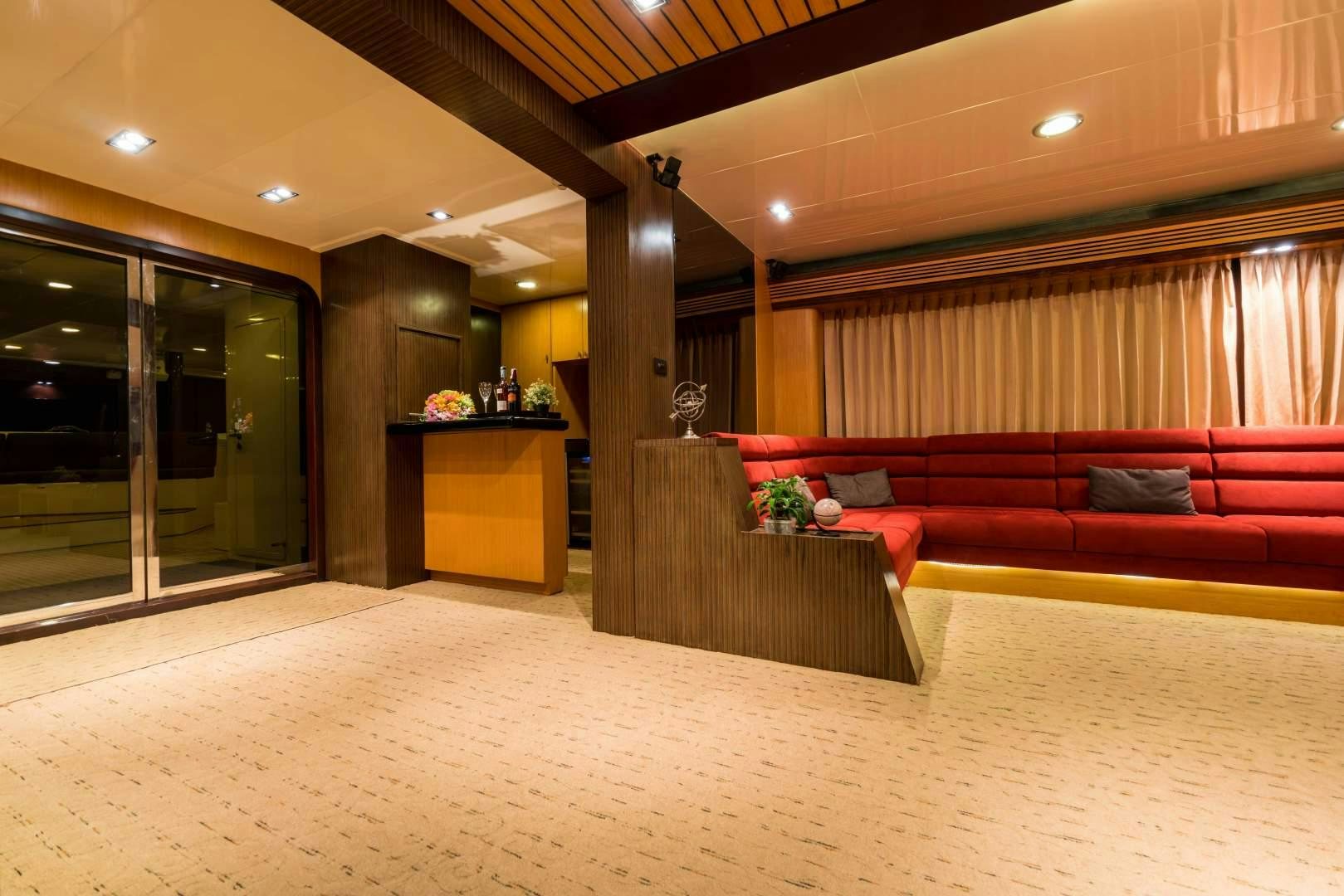 a room with couches and a table aboard PHATSARA Yacht for Sale