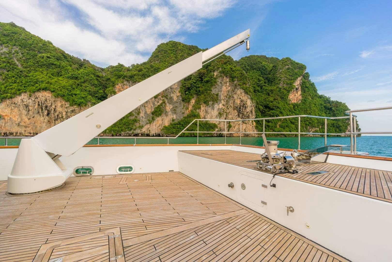 a deck with a large building on it by the water aboard PHATSARA Yacht for Sale