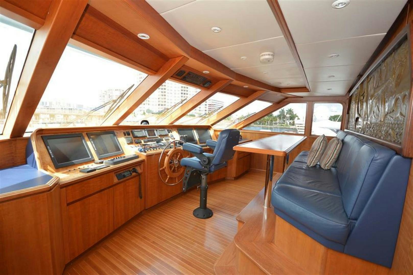 a boat with a desk and a couch aboard AR DE Yacht for Sale