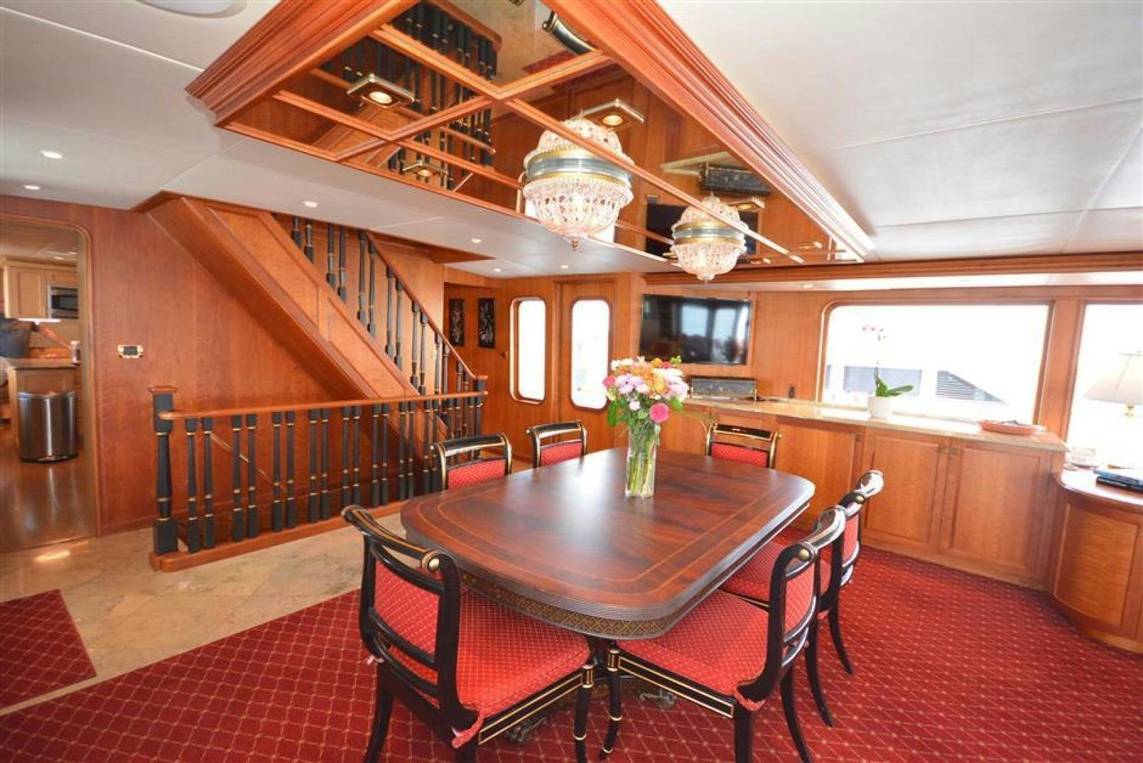 a dining room with a table and chairs aboard AR DE Yacht for Sale