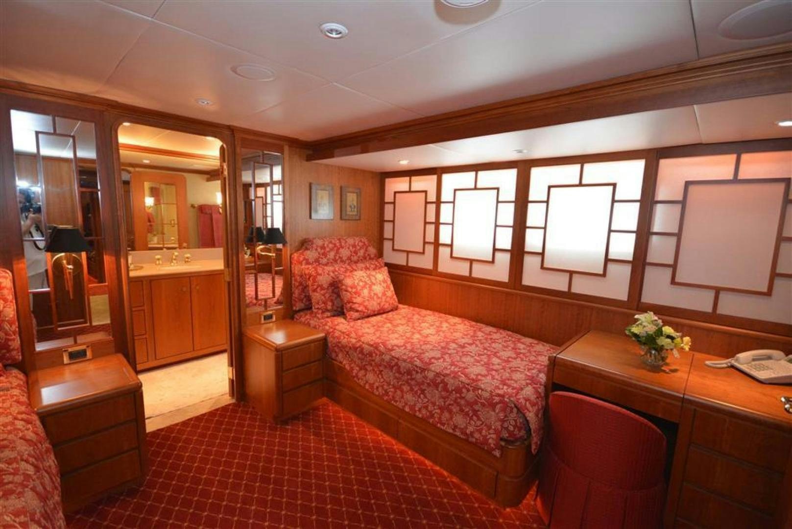 a bedroom with a bed and a desk aboard AR DE Yacht for Sale