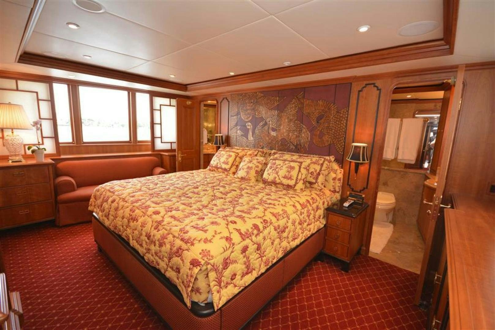 a bedroom with a bed and a mirror aboard AR DE Yacht for Sale
