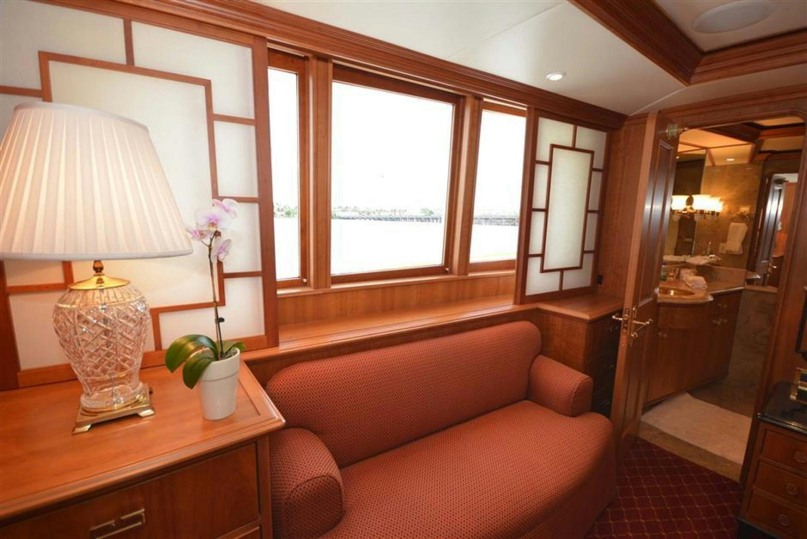 a living room with a couch and a lamp aboard AR DE Yacht for Sale