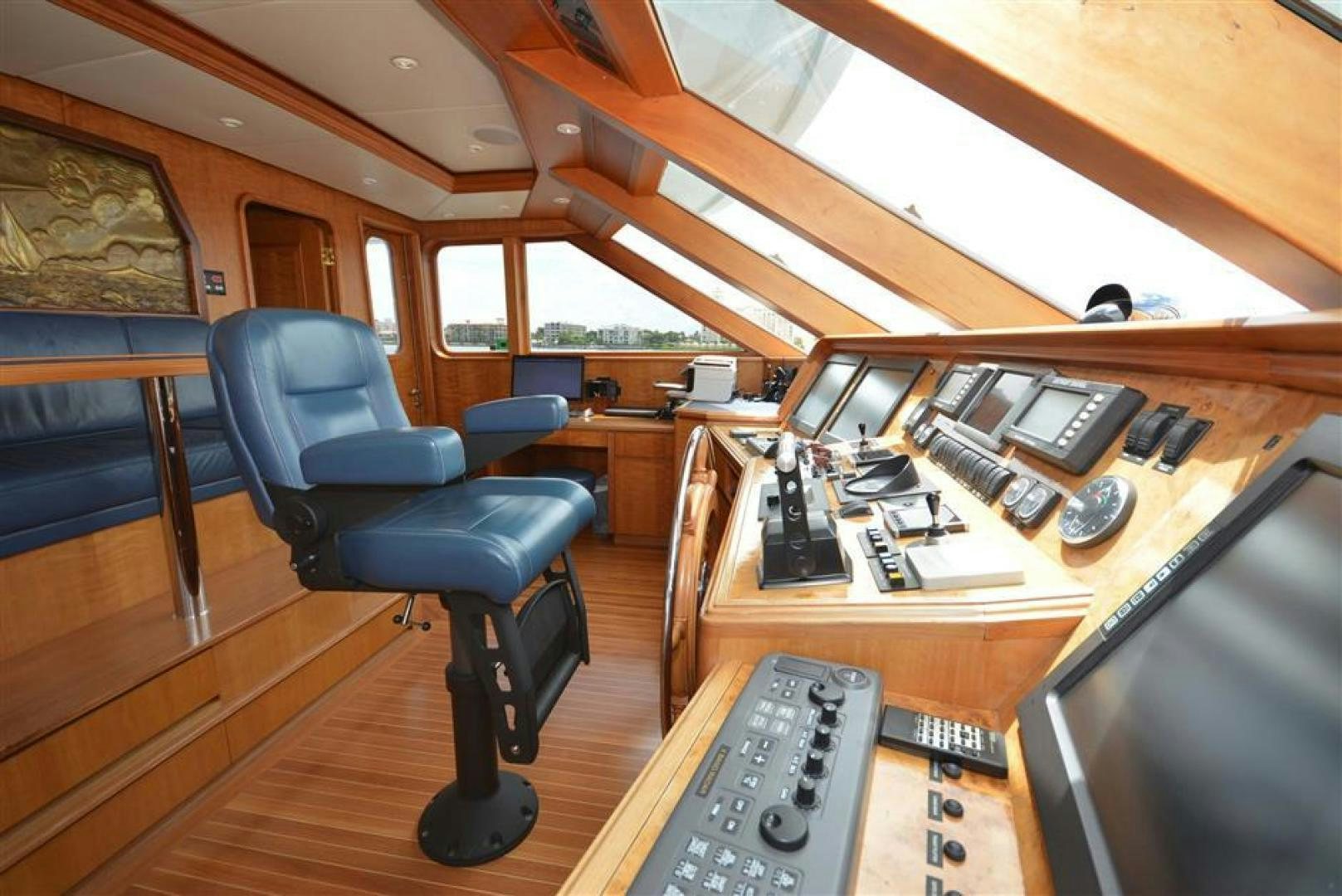 a room with a desk and chairs aboard AR DE Yacht for Sale