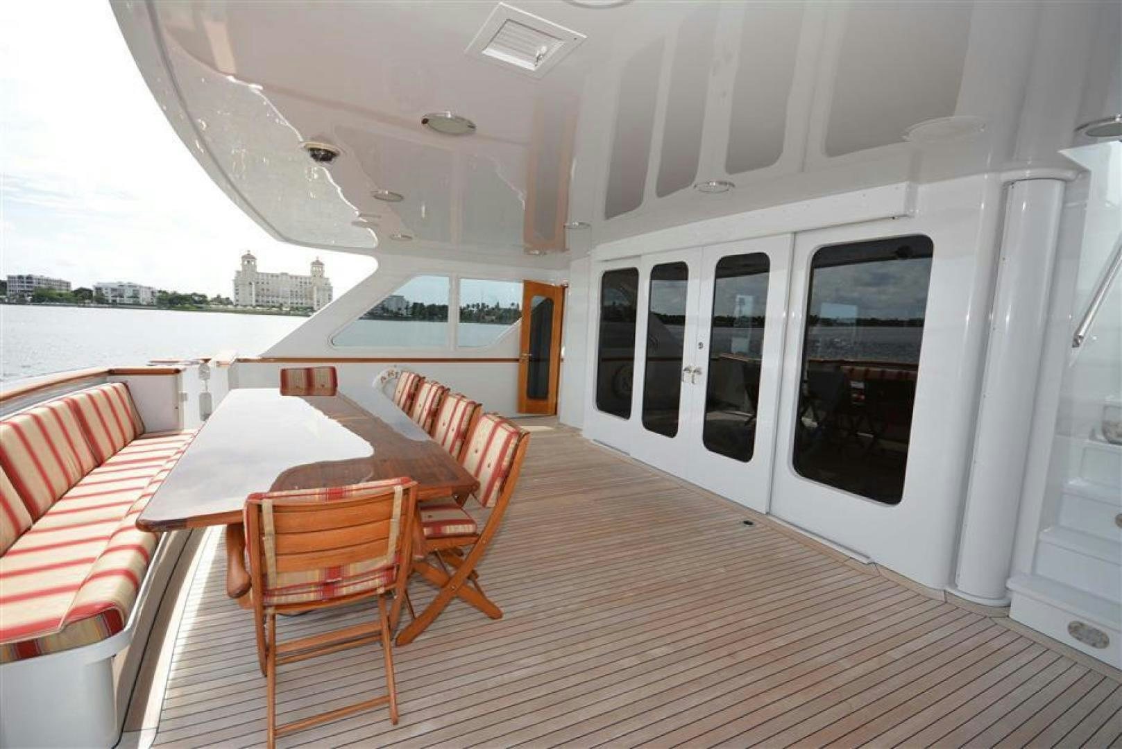 a room with a table and chairs aboard AR DE Yacht for Sale