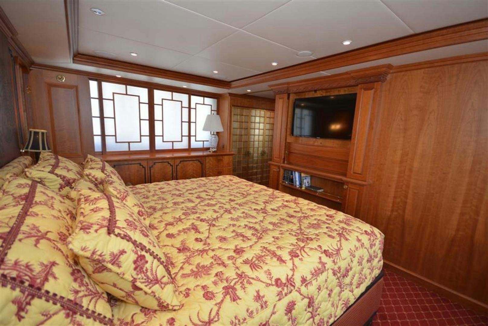 a bedroom with a bed and a television aboard AR DE Yacht for Sale