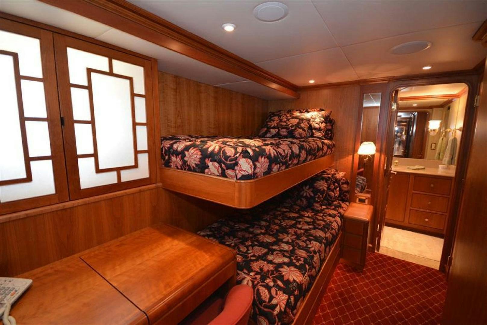 a bedroom with a bed and a mirror aboard AR DE Yacht for Sale