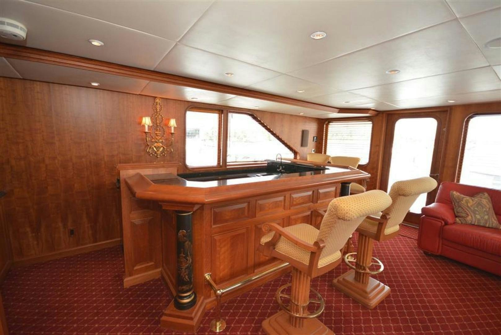 a room with a table and chairs aboard AR DE Yacht for Sale