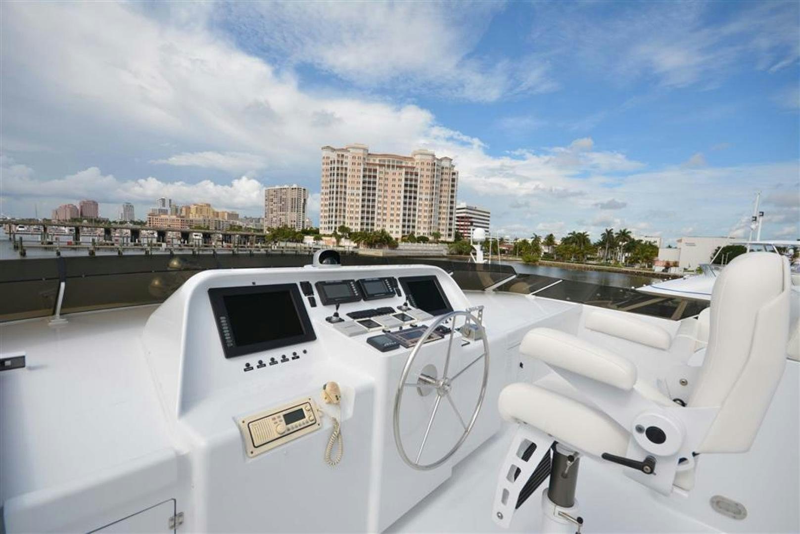 a white yacht on a deck aboard AR DE Yacht for Sale