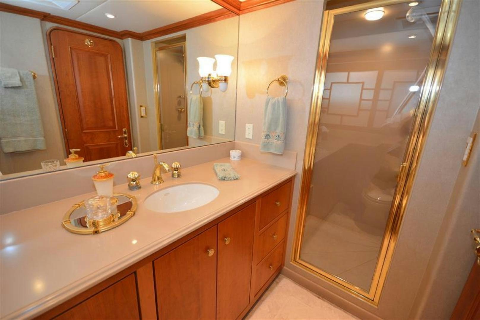 a bathroom with a countertop sink and mirror aboard AR DE Yacht for Sale