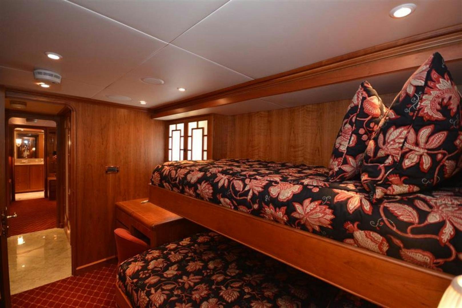 a bedroom with a bed and a desk aboard AR DE Yacht for Sale