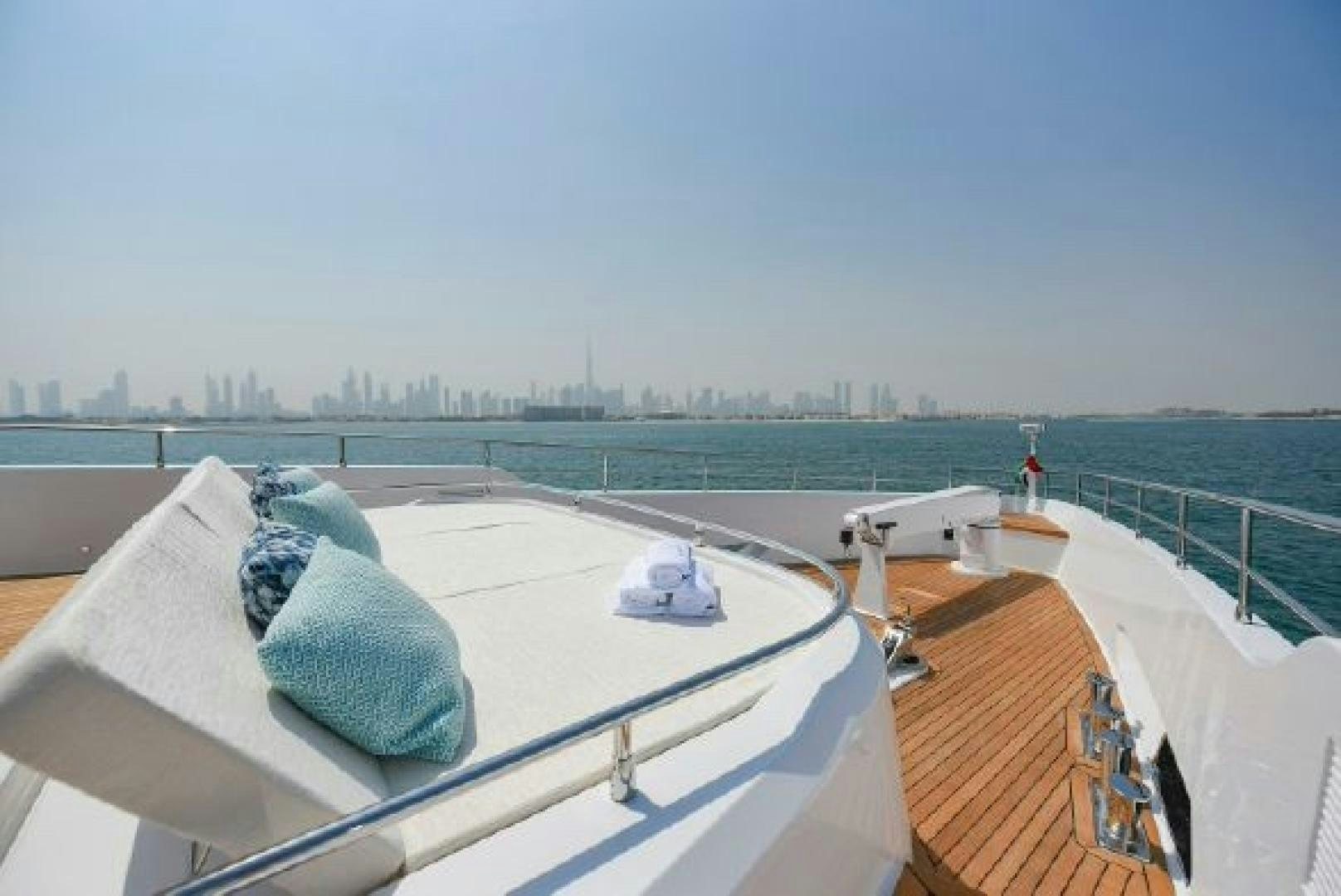 a deck with a blanket and a hat on it aboard No Name Yacht for Sale