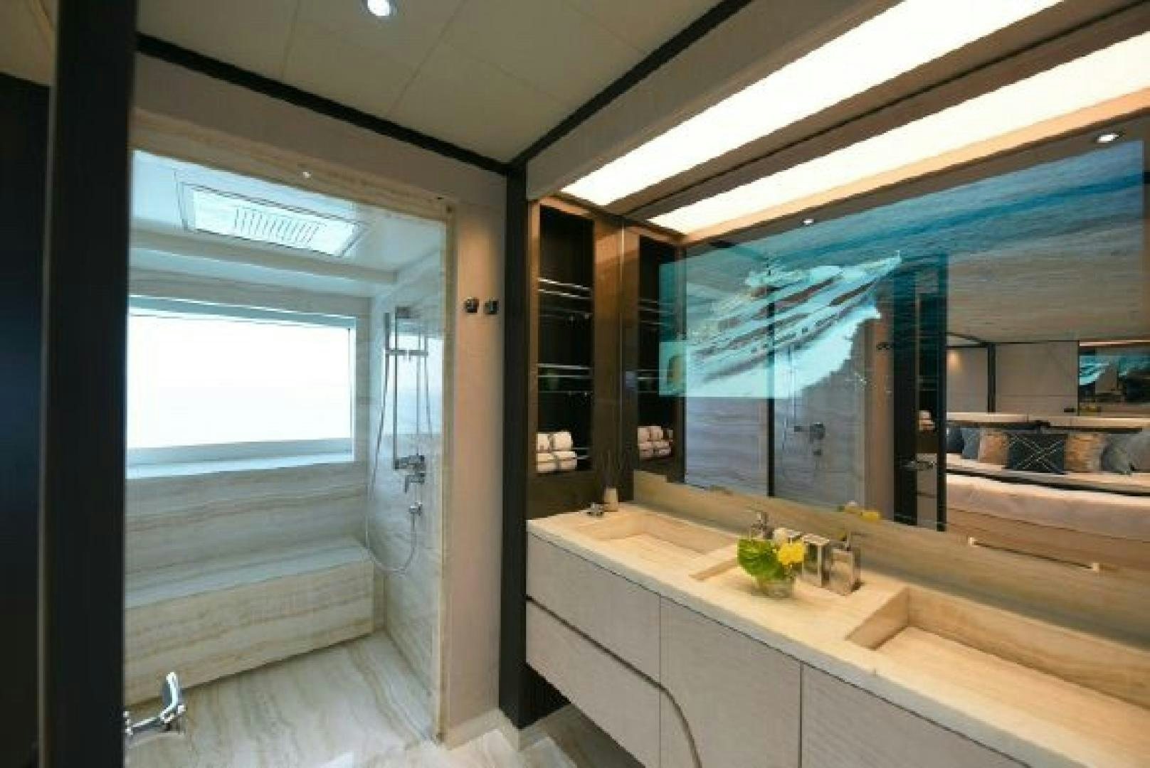 a bathroom with a large window aboard No Name Yacht for Sale