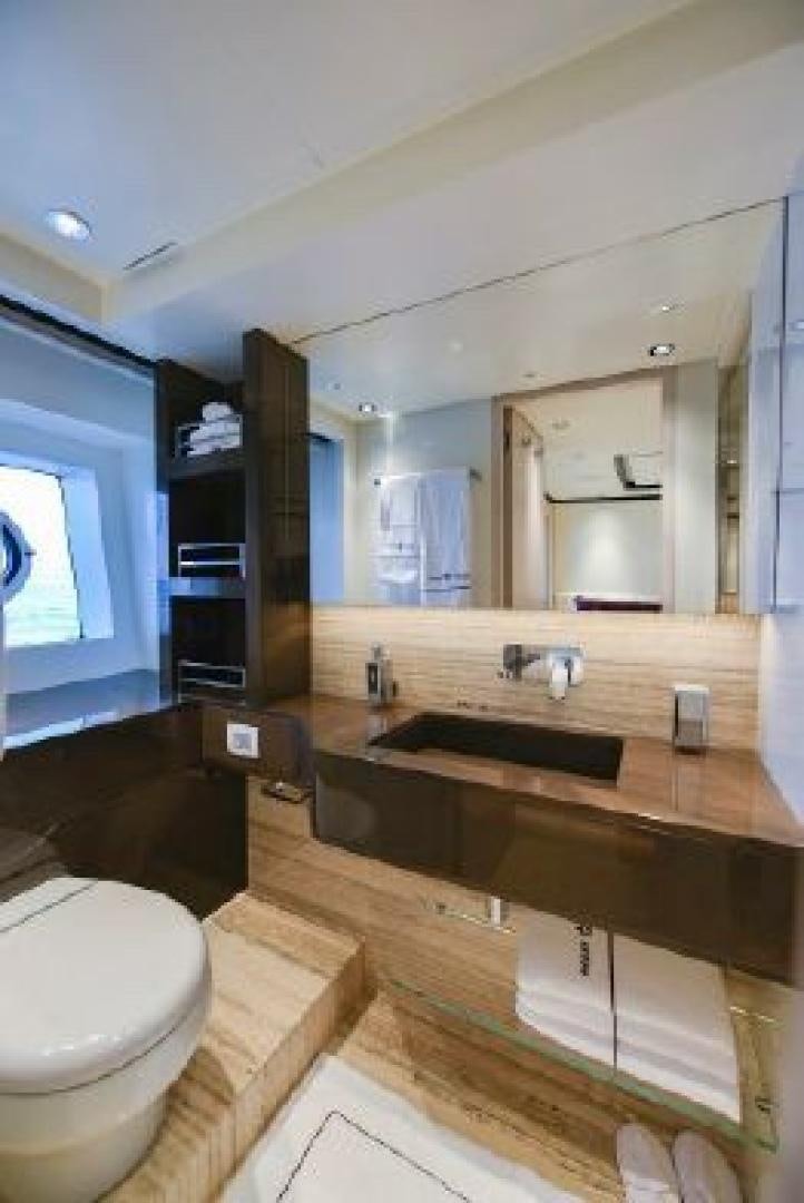 a bathroom with a large mirror aboard No Name Yacht for Sale