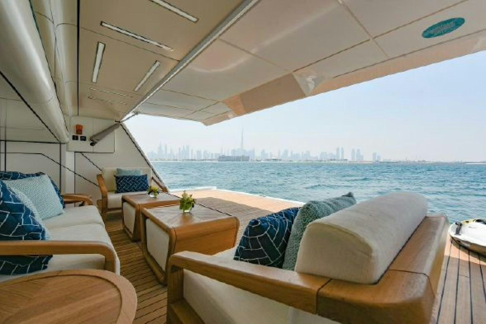 a boat with a city skyline in the background aboard No Name Yacht for Sale