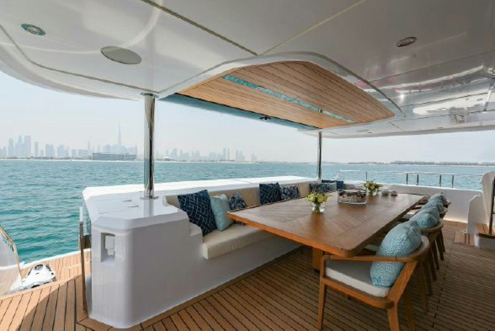 a table and chairs on a boat aboard No Name Yacht for Sale