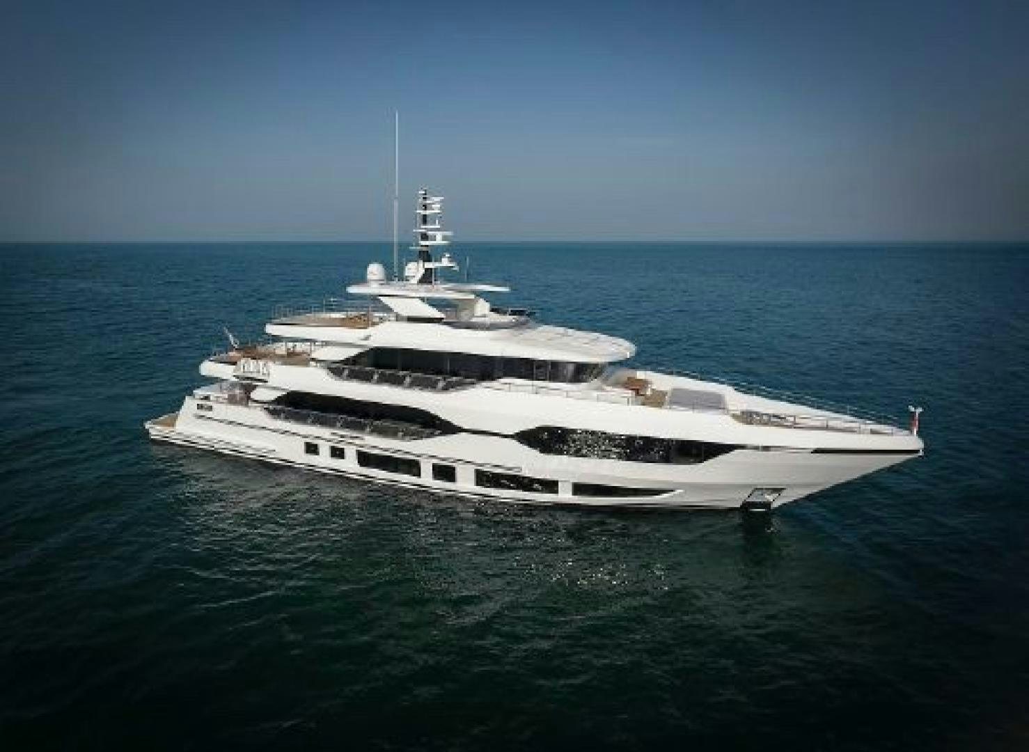 a large white yacht in the ocean aboard No Name Yacht for Sale