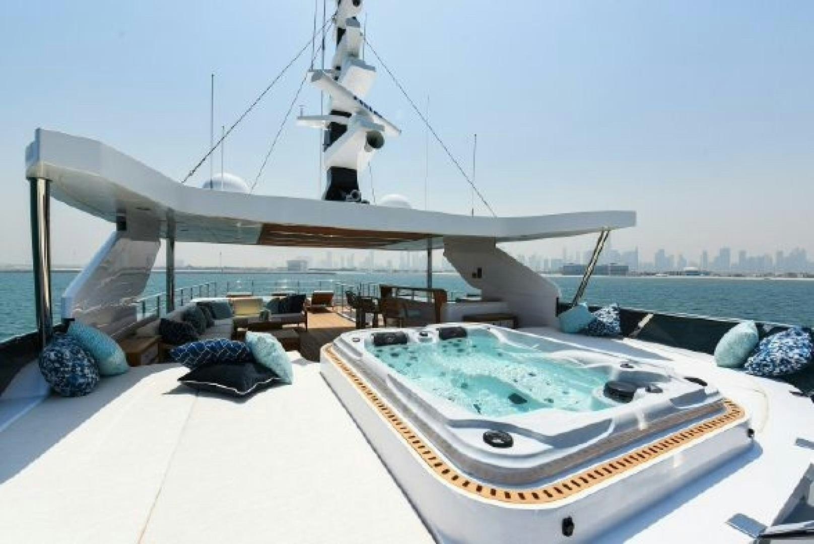 a large white pool with a large metal structure in the background aboard No Name Yacht for Sale