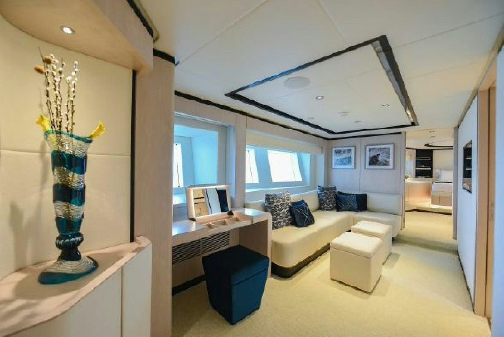 a living room with a large window aboard No Name Yacht for Sale