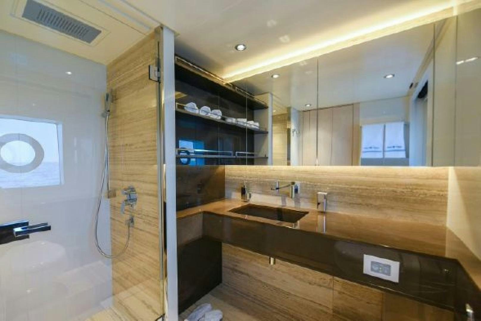 a bathroom with a large mirror aboard No Name Yacht for Sale