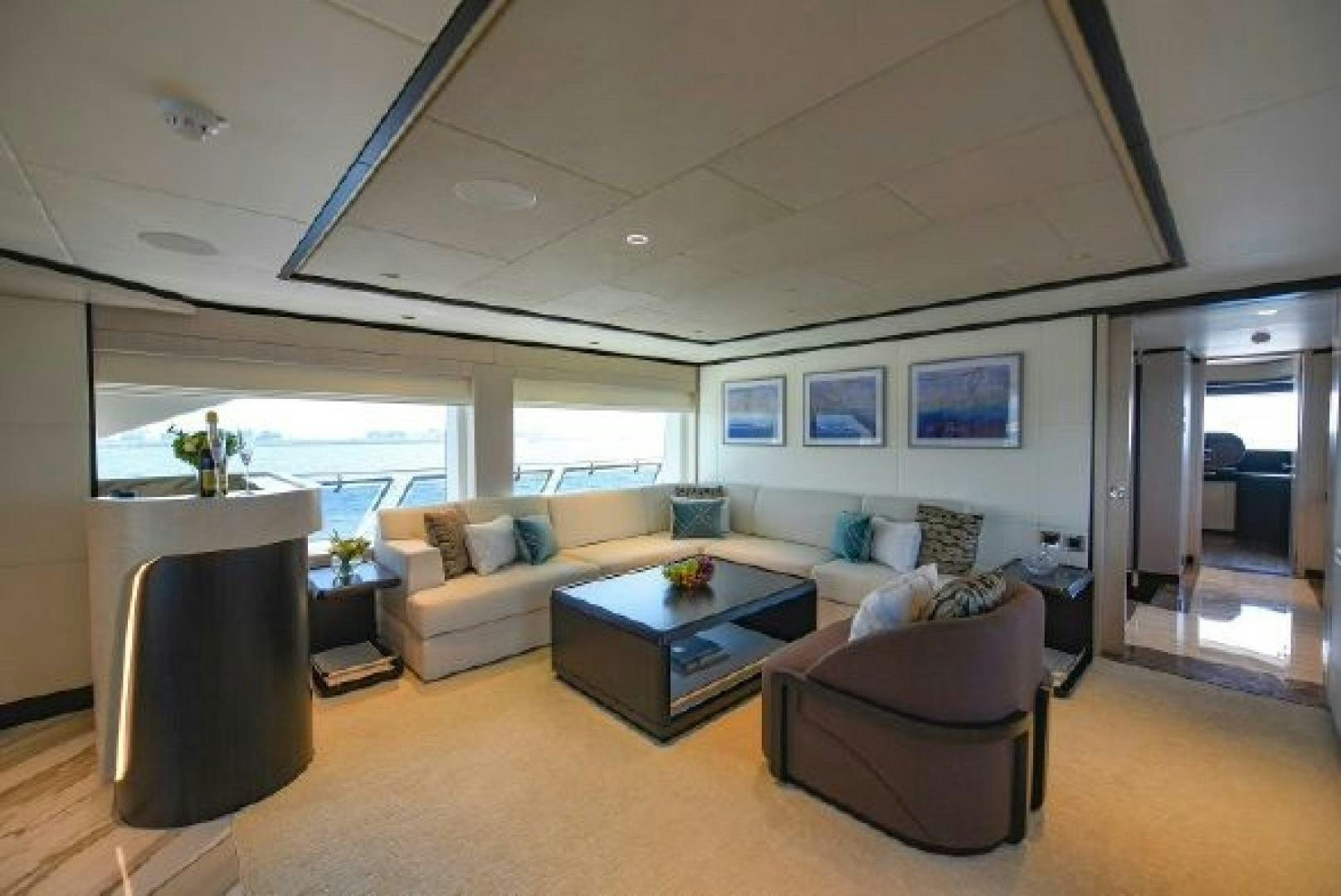 a living room with a large window aboard No Name Yacht for Sale