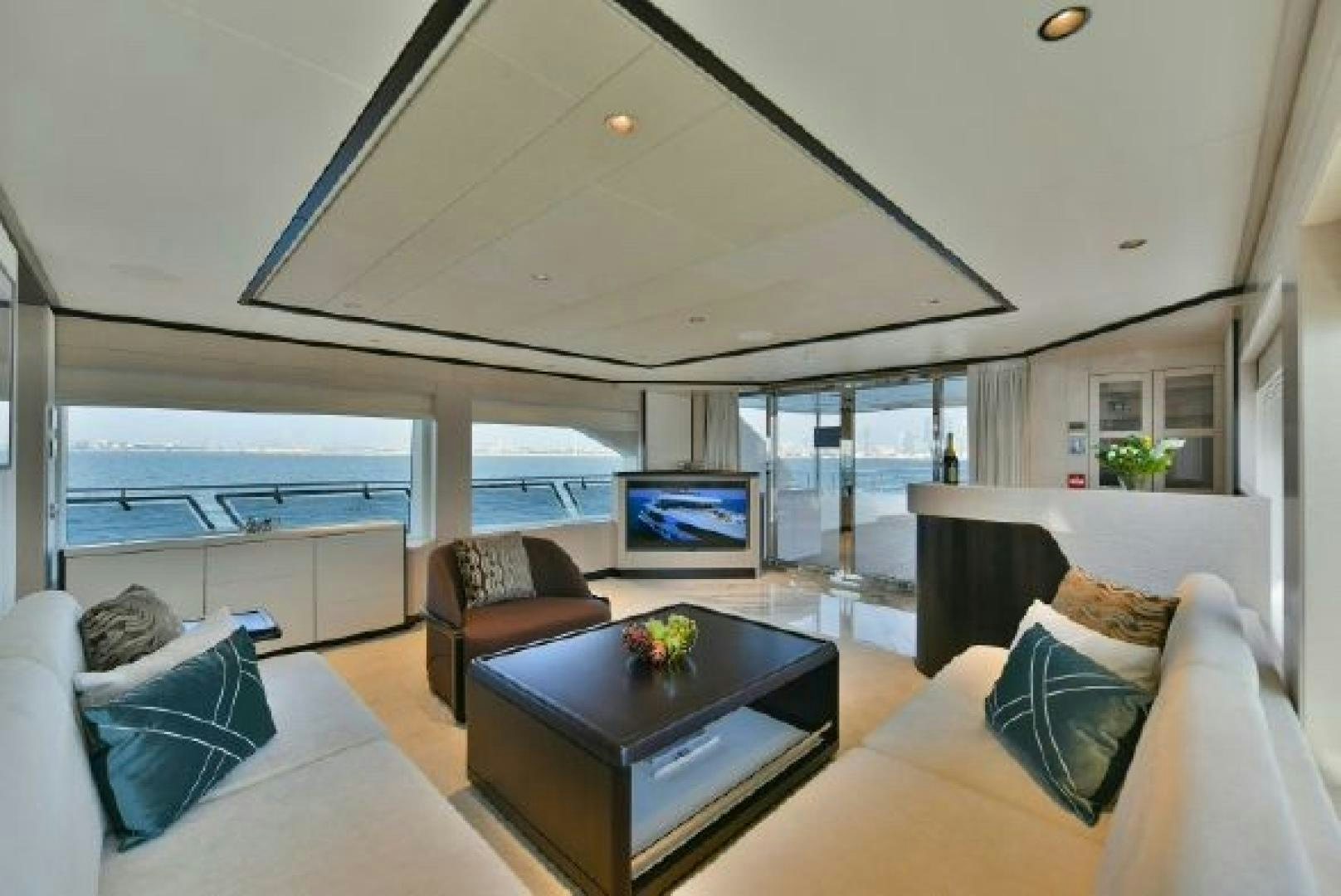 a living room with a large window aboard No Name Yacht for Sale