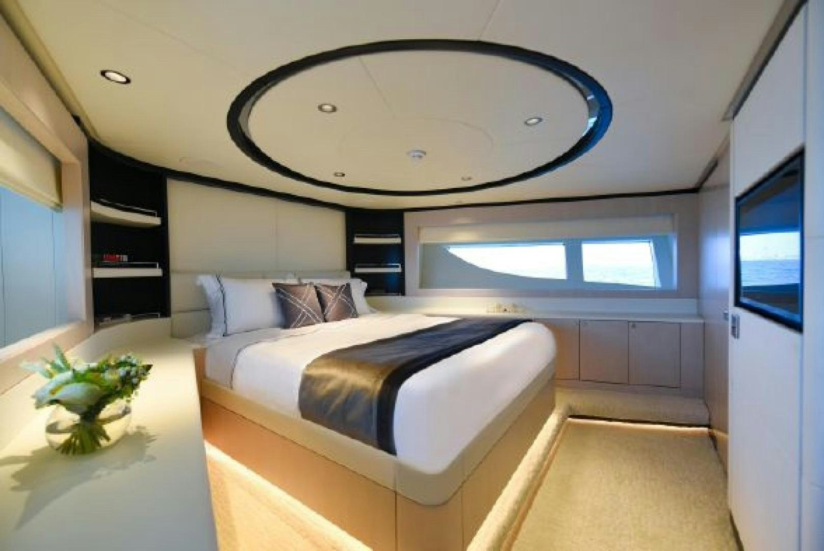 a bedroom with a large mirror aboard No Name Yacht for Sale