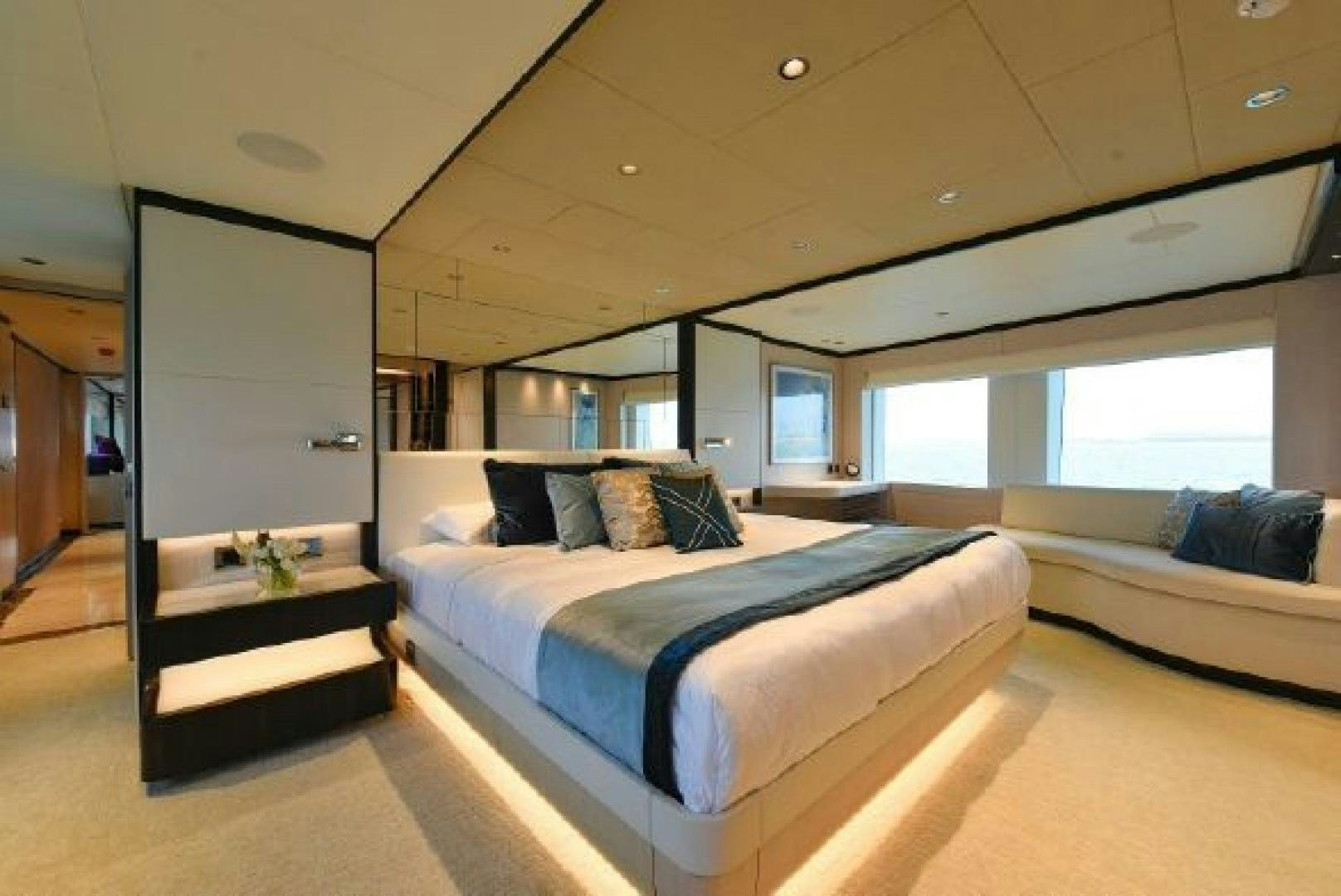 a room with a bed and a desk aboard No Name Yacht for Sale