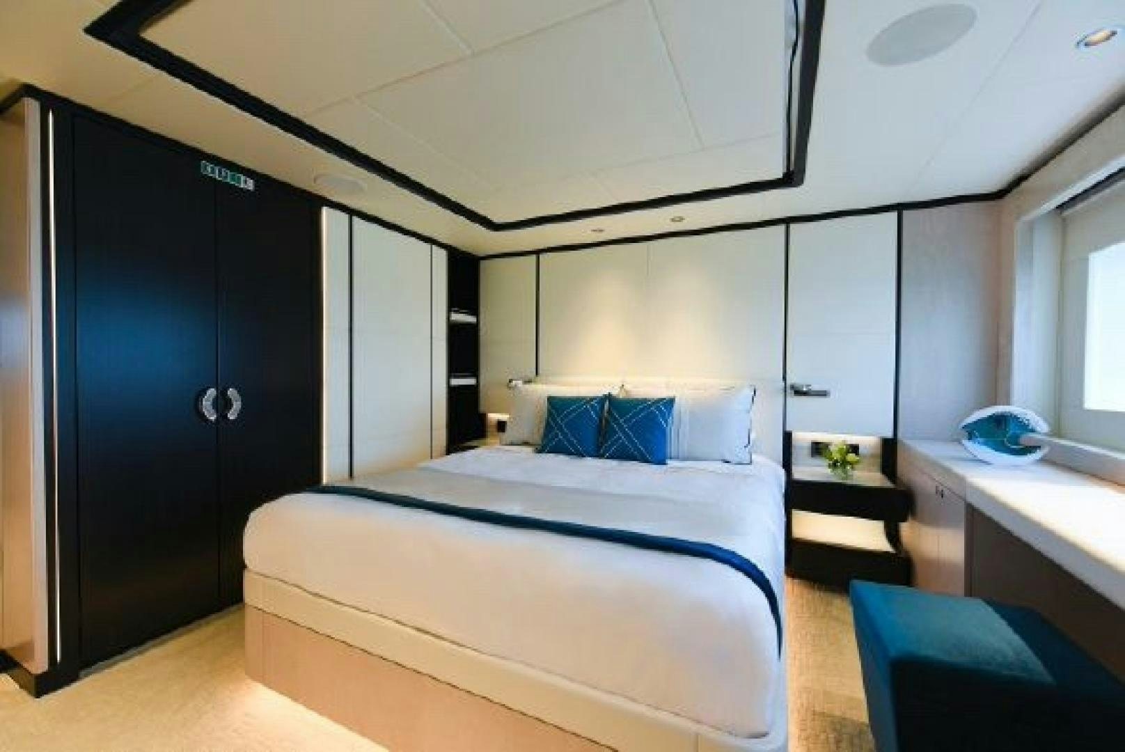 a bed in a room aboard No Name Yacht for Sale