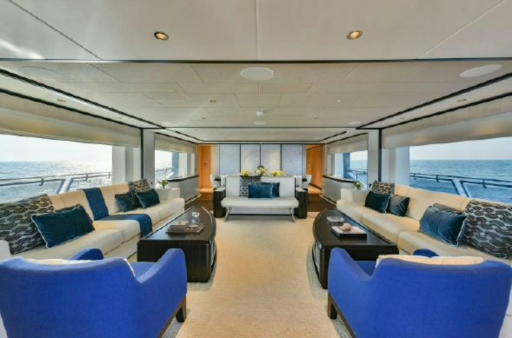 a large living room with a large window aboard No Name Yacht for Sale