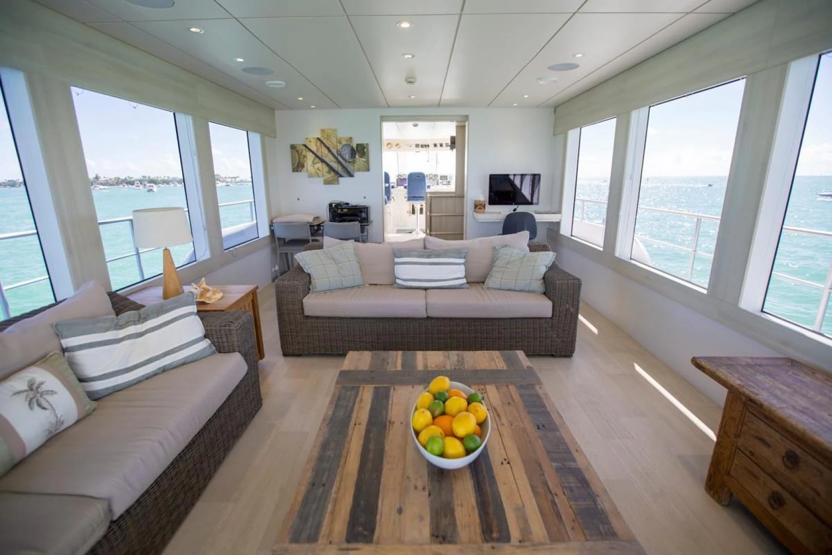a living room with a couch and a table aboard KAHU Yacht for Sale