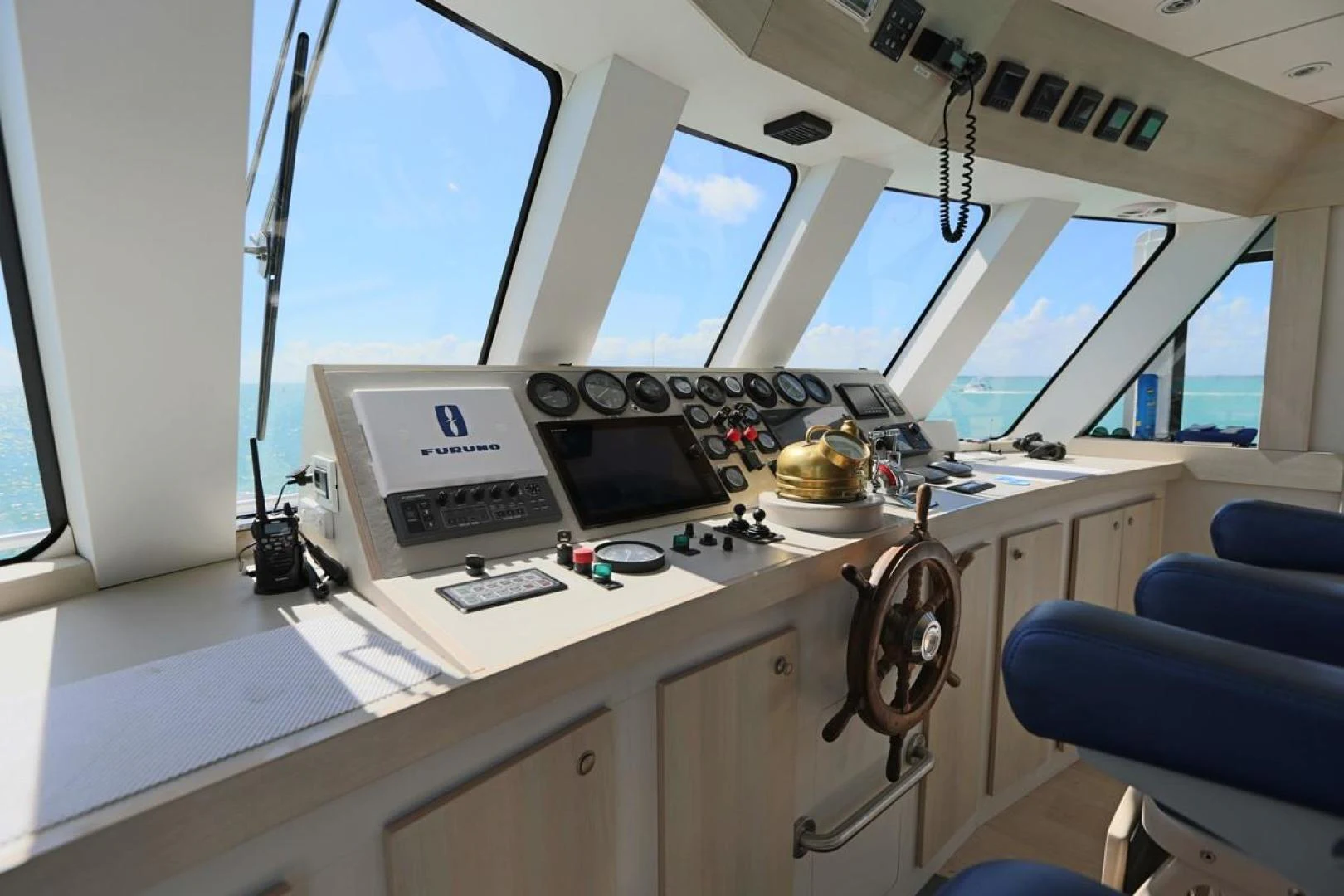 a white desk with a computer and a printer on it aboard KAHU Yacht for Sale