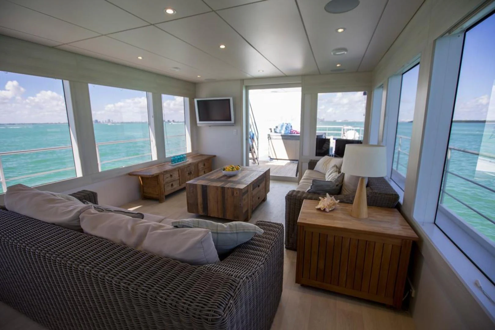 a living room with a large window aboard KAHU Yacht for Sale