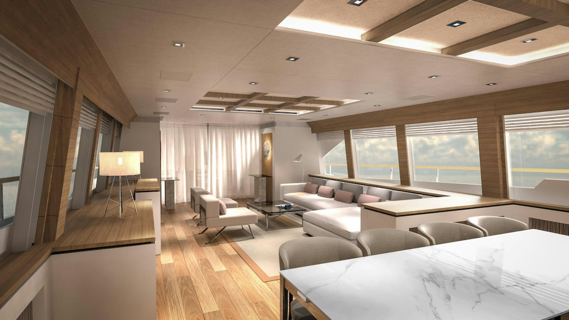 a large room with a couch and a table aboard No Name Yacht for Sale