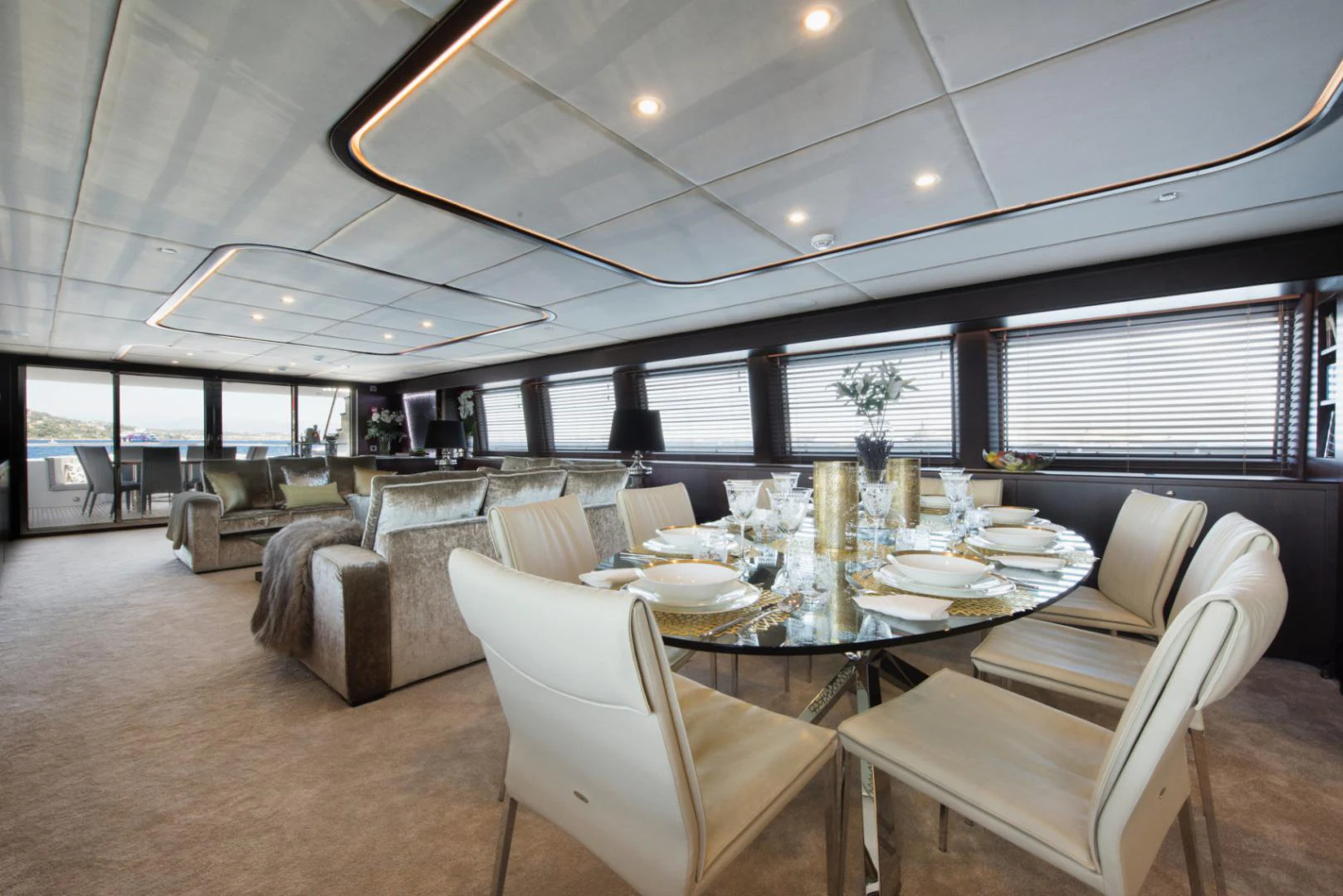 a large room with a table and chairs aboard CRYSTAL Yacht for Sale