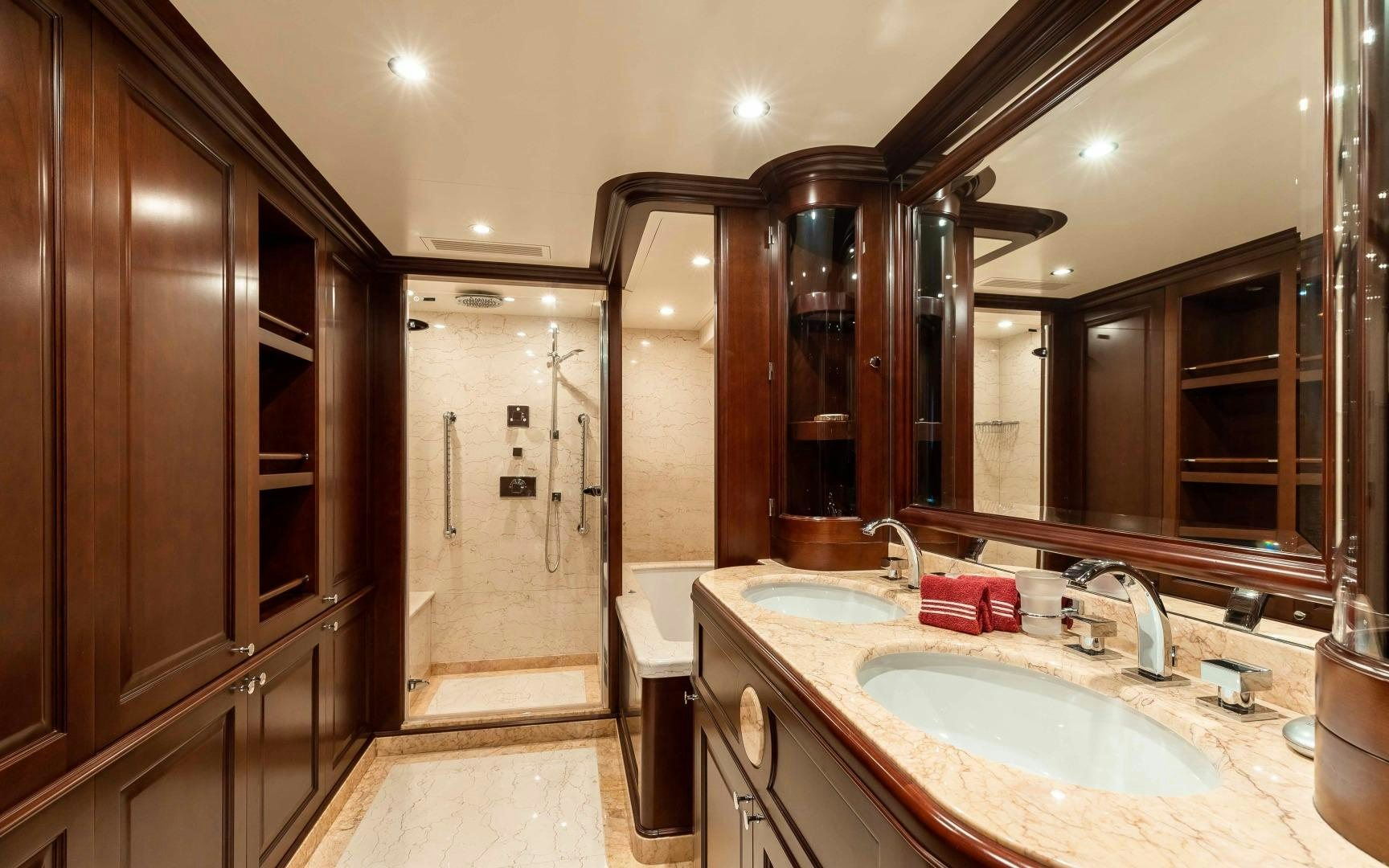 a bathroom with a large mirror aboard TANUSHA Yacht for Sale