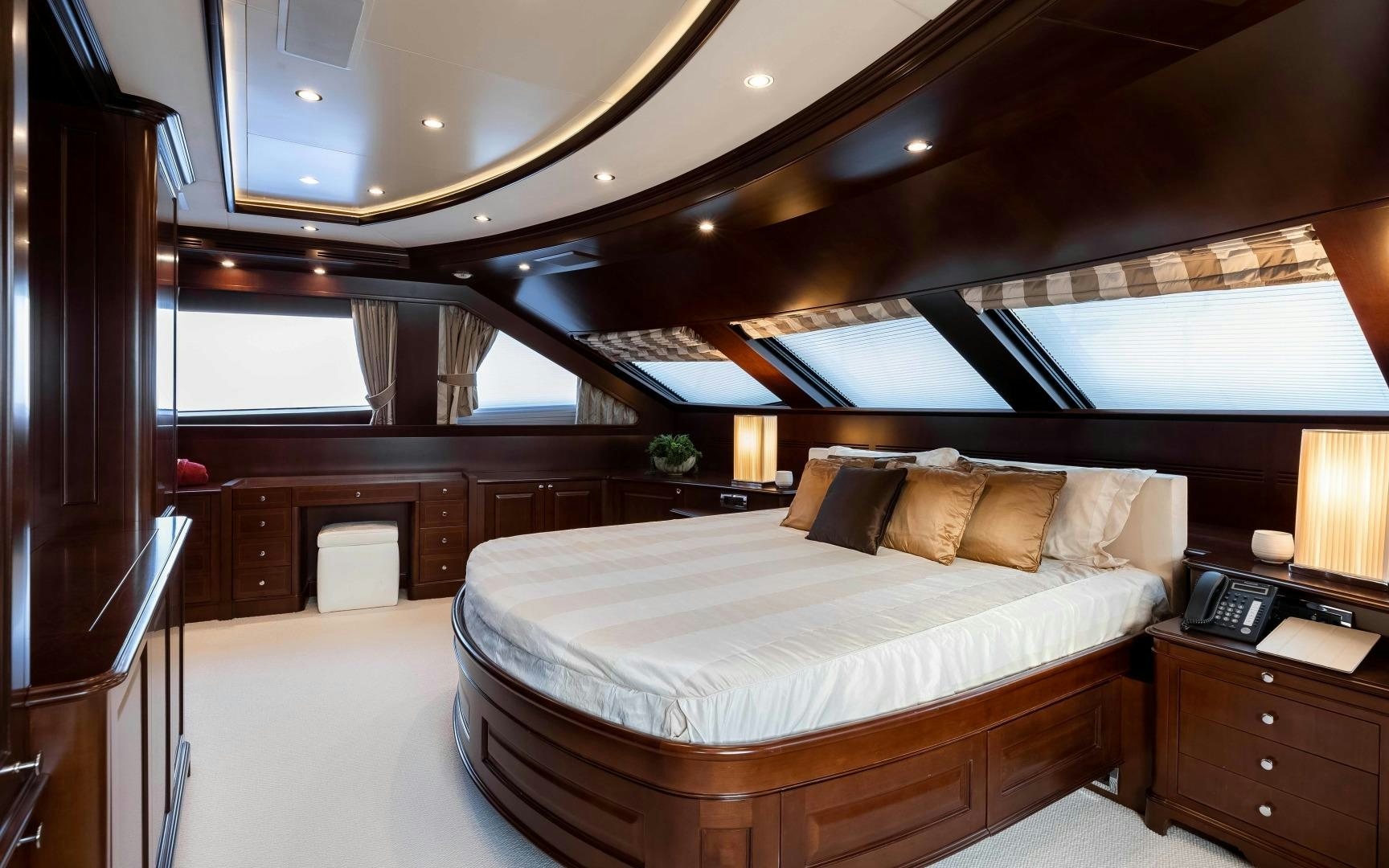 a large bed in a room aboard TANUSHA Yacht for Sale