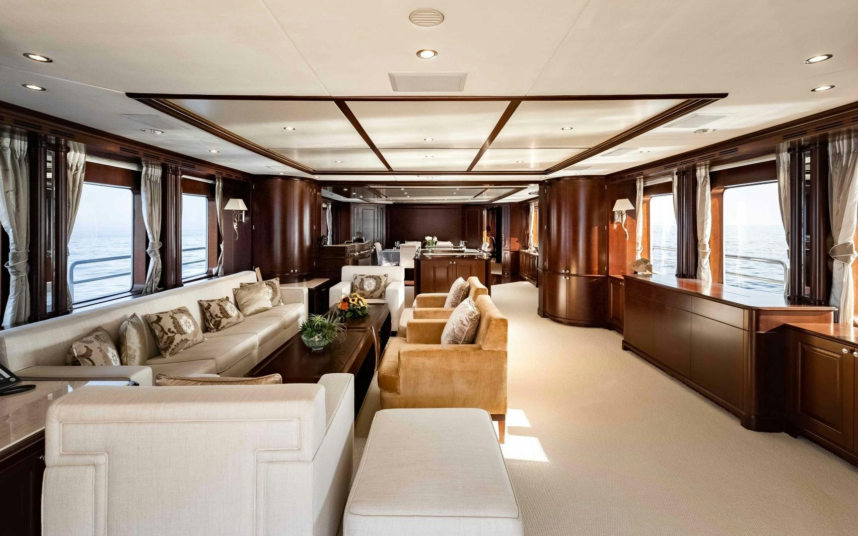 a living room with a couch and a table aboard TANUSHA Yacht for Sale