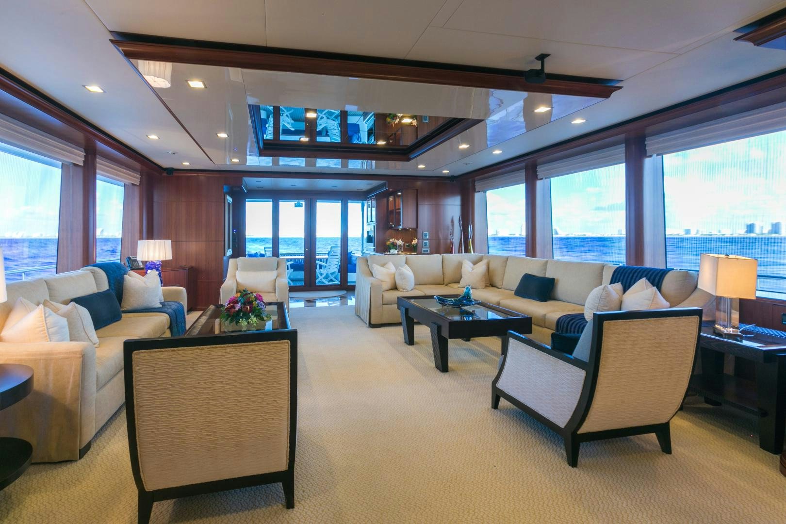 a living room with a couch and a table aboard MY AURORA Yacht for Sale