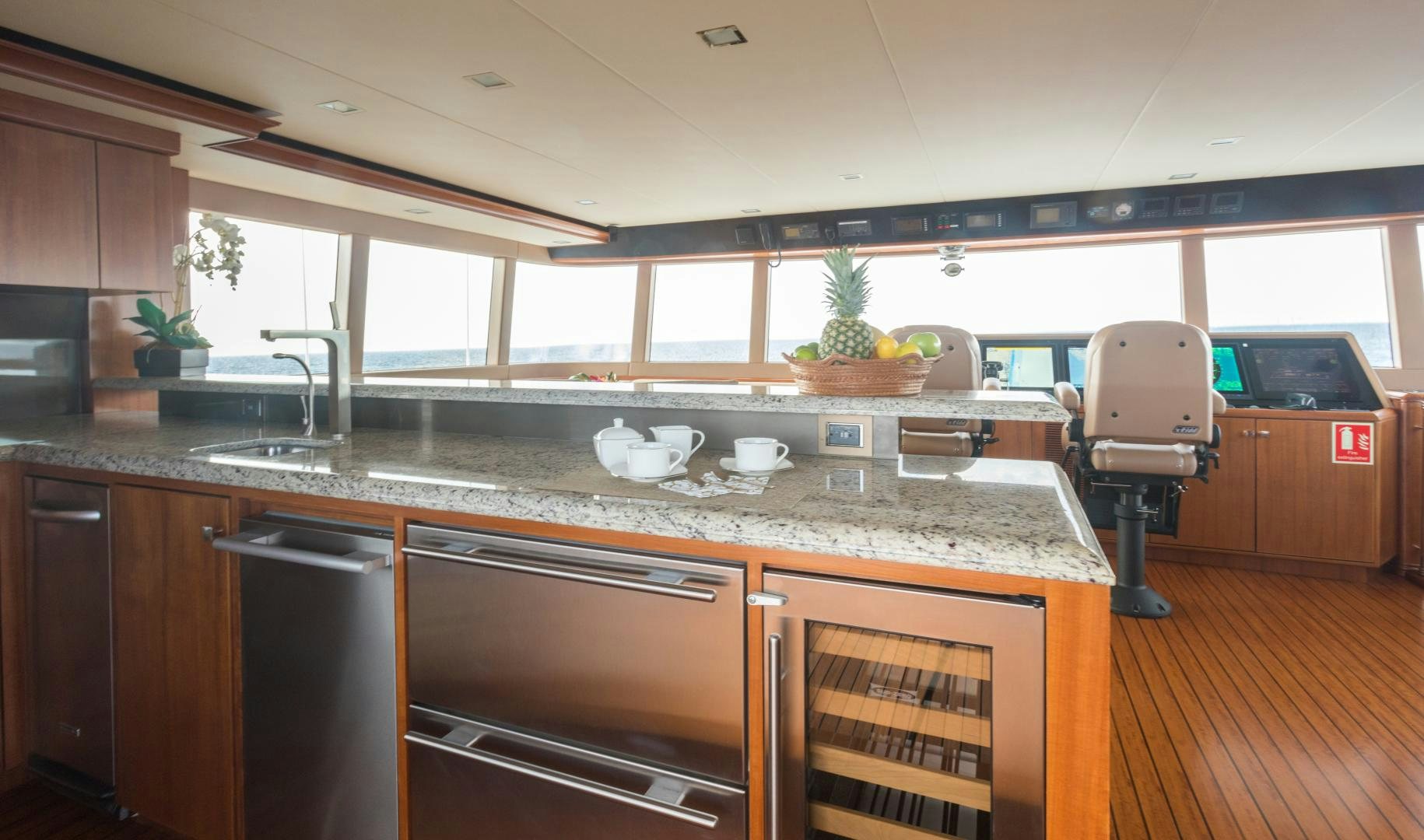 a kitchen with a large island aboard MY AURORA Yacht for Sale