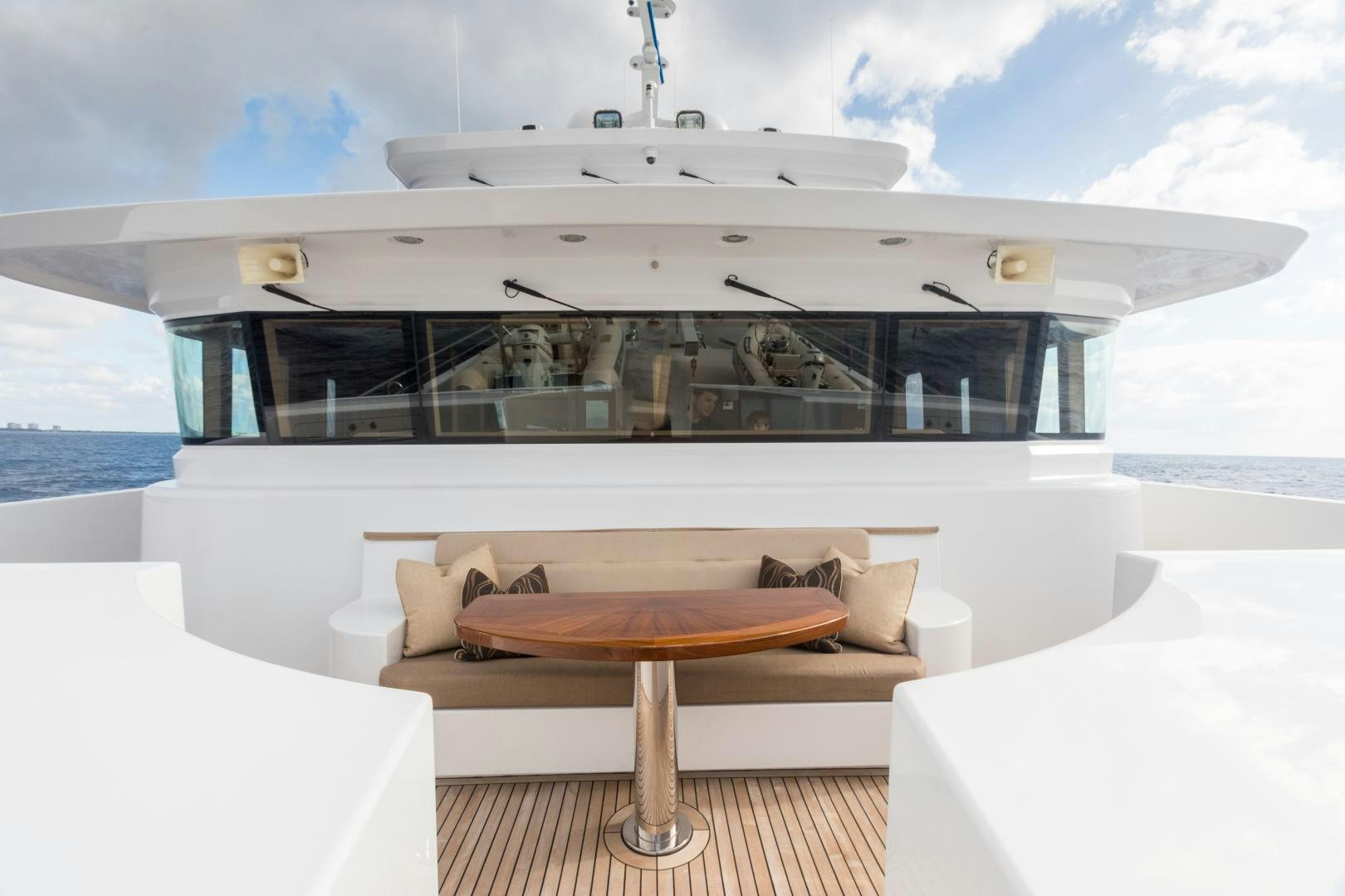a room with a table and a couch aboard MY AURORA Yacht for Sale