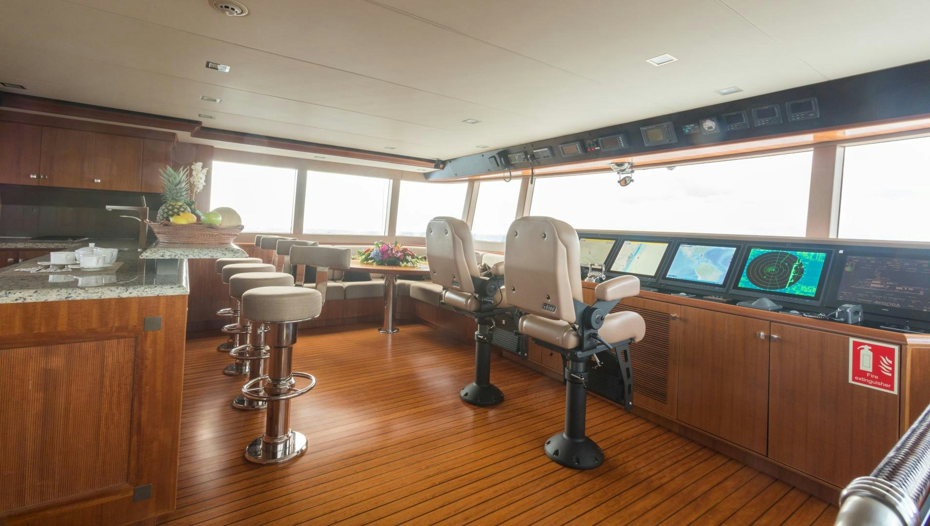 a room with a desk and chairs aboard MY AURORA Yacht for Sale