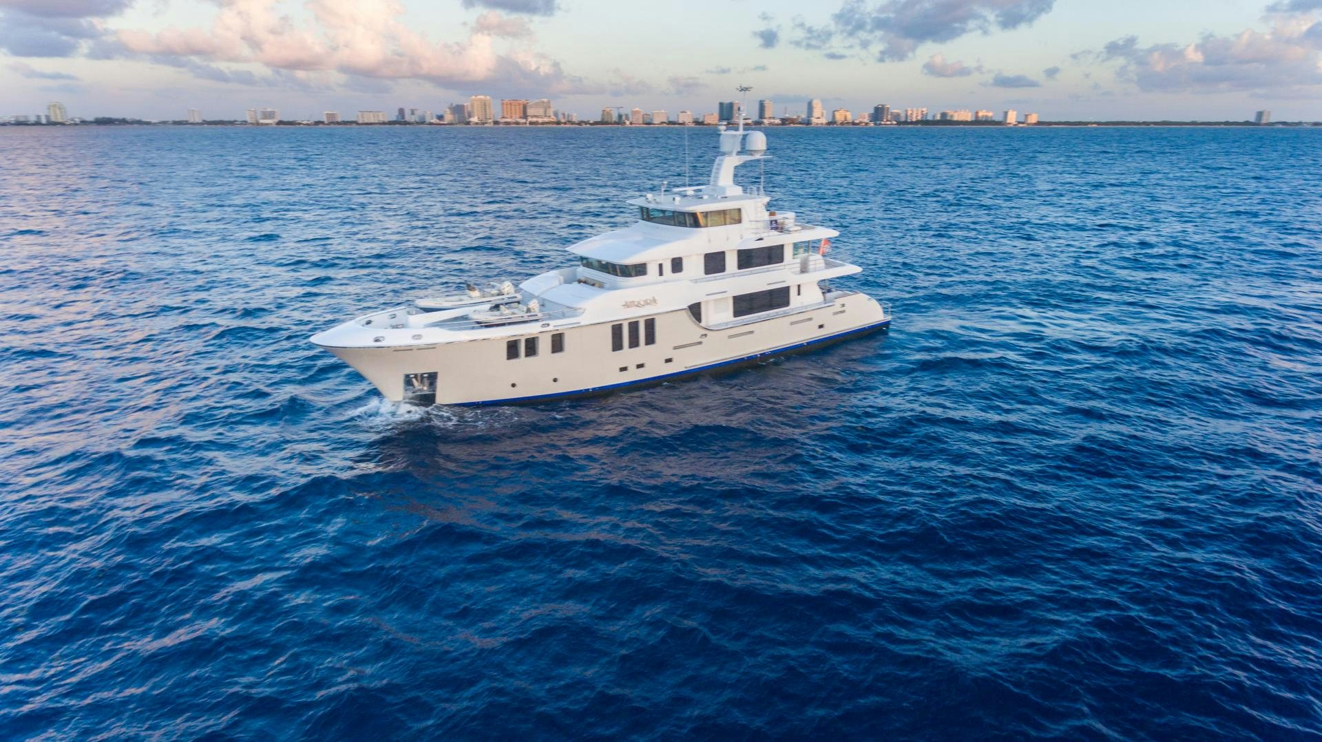 a white yacht in the water aboard MY AURORA Yacht for Sale