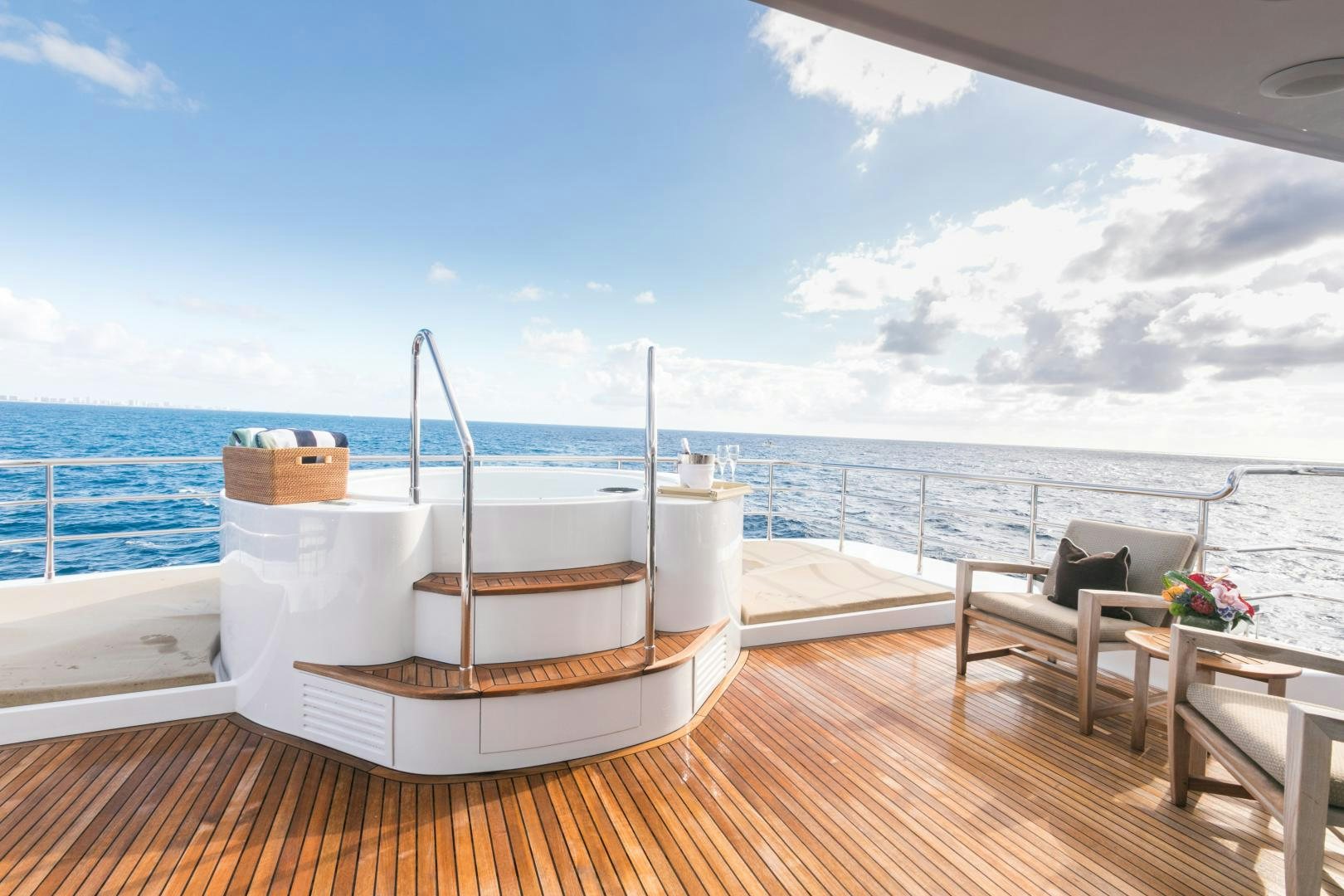 a deck with a view of the ocean and the ocean aboard MY AURORA Yacht for Sale
