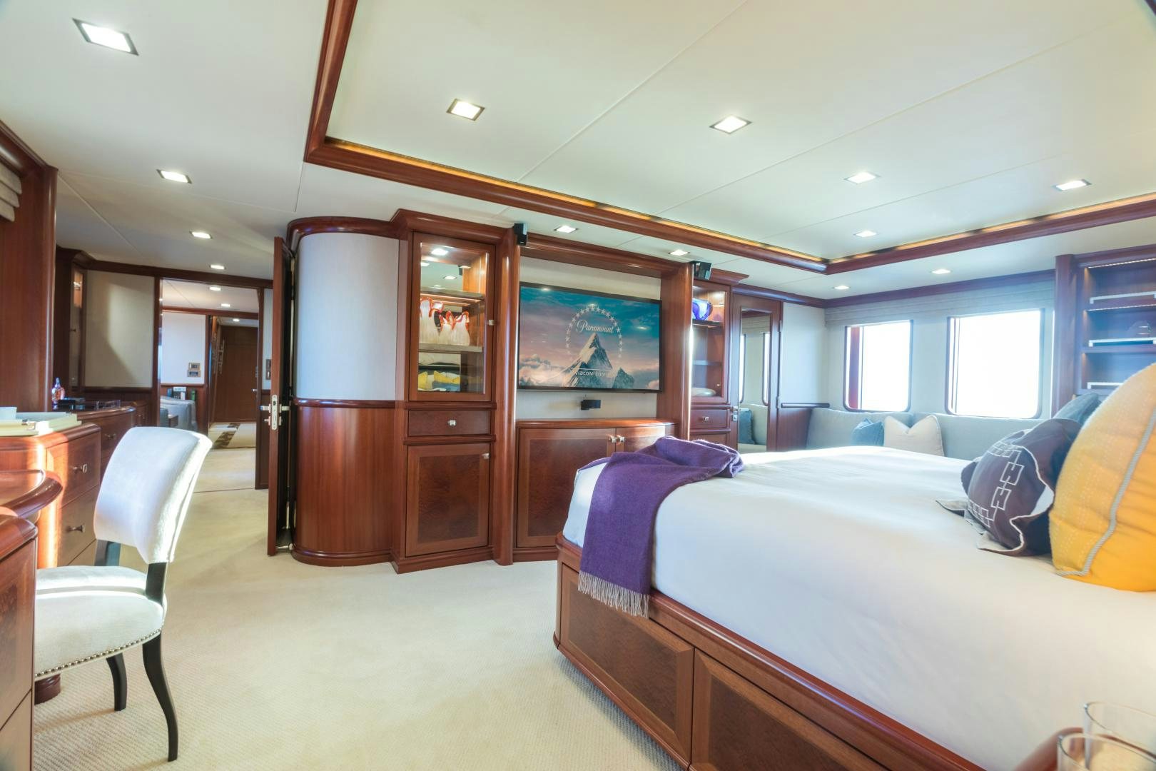 a bedroom with a bed and a desk aboard MY AURORA Yacht for Sale