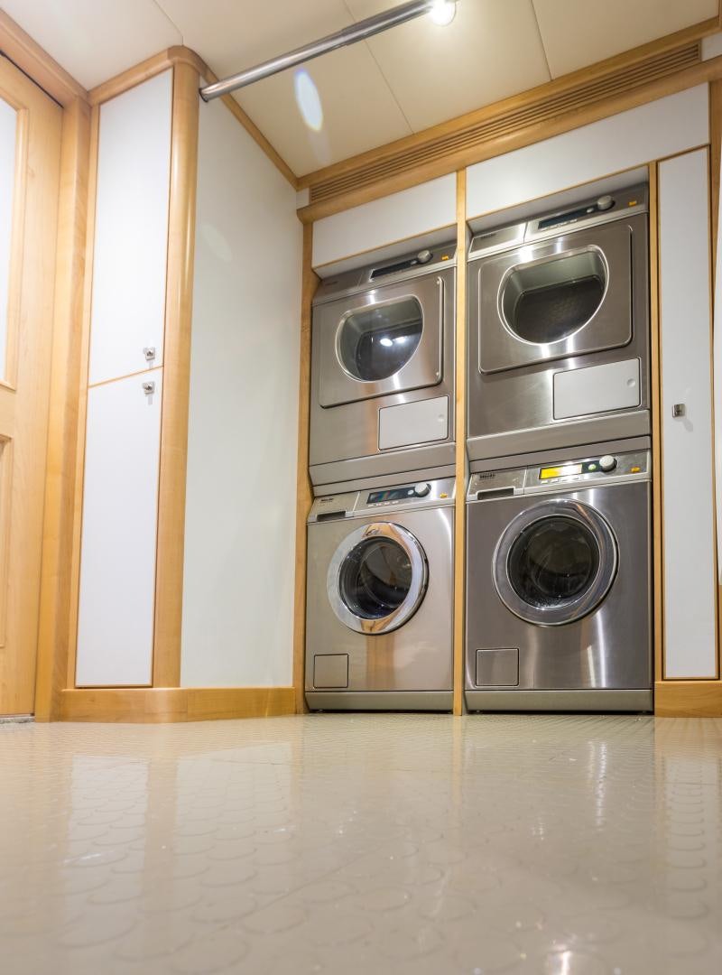 a room with washer and dryer aboard MY AURORA Yacht for Sale